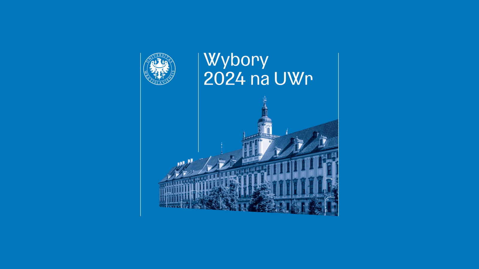 gmach dużego budynku z wieżą na niebieskim tle
